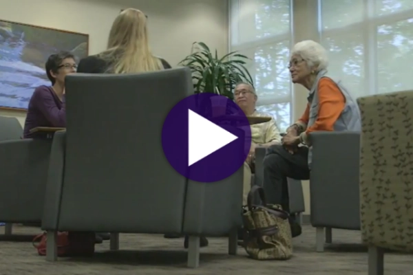 Cancer Center patients sitting in a circle discussing their cancer stories.